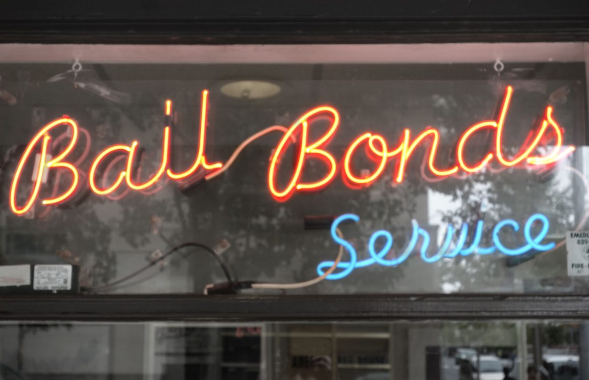 Neon Bail Bond sign in window